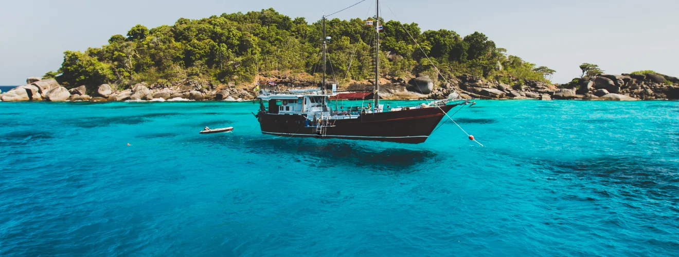 Diving School Bali Liveaboard vessels, those floating sanctuaries of adventure, find their tranquil moorings in the shallow waters.